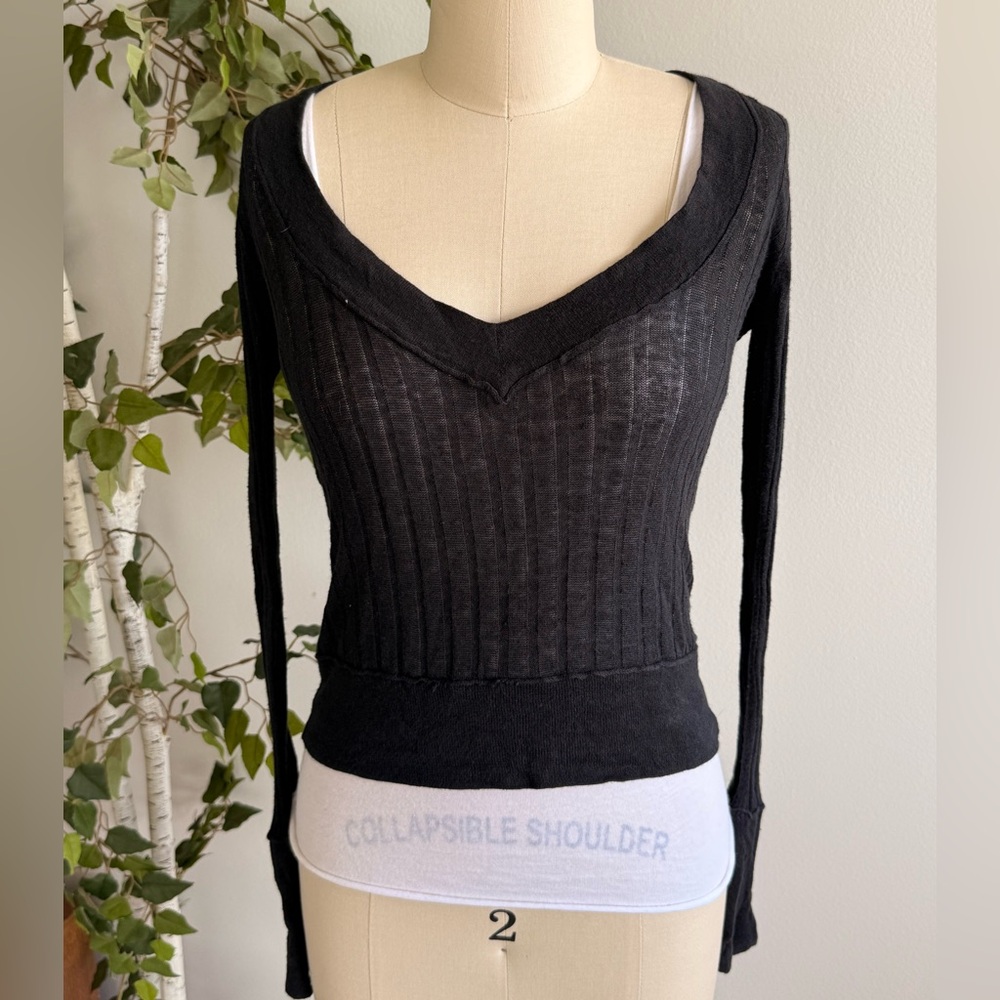 Layered white top with black tight sweater